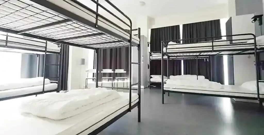 An overview of the dorm rooms at K7 Hotel Oslo with several bunk beds.